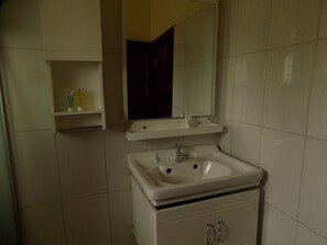Shower, slippers, towels, soap