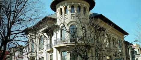 A historic building with a prominent dome and arched windows.