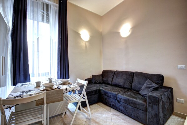 Apartment, 1 Bedroom | Living area | 32-inch flat-screen TV with digital channels, TV