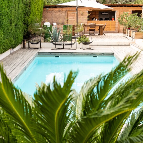 Outdoor pool, open 8:00 AM to 9:00 PM, pool umbrellas, sun loungers