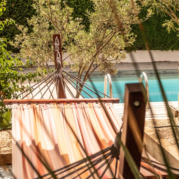 Outdoor pool, open 8:00 AM to 9:00 PM, pool umbrellas, pool loungers