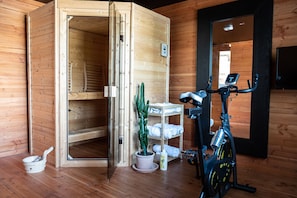 Enjoy a relaxing stay with a sauna and treadmill, plus a touch of greenery from the potted cactus.