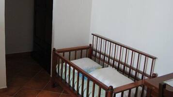 Desk, iron/ironing board, free cribs/infant beds, bed sheets