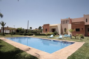 Outdoor pool, pool umbrellas, pool loungers