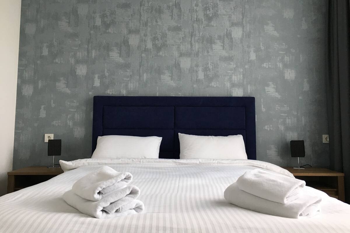 Apartment (Blue) | Premium bedding, Select Comfort beds, desk, blackout drapes