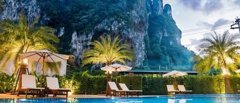 Outdoor pool, open 8:00 AM to 8:00 PM, pool loungers