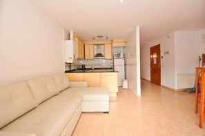 Apartment, 1 Bedroom | Living area | 32-inch flat-screen TV with digital channels, TV