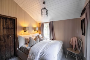 Village Cabin Suite | Premium bedding, minibar, individually decorated, individually furnished