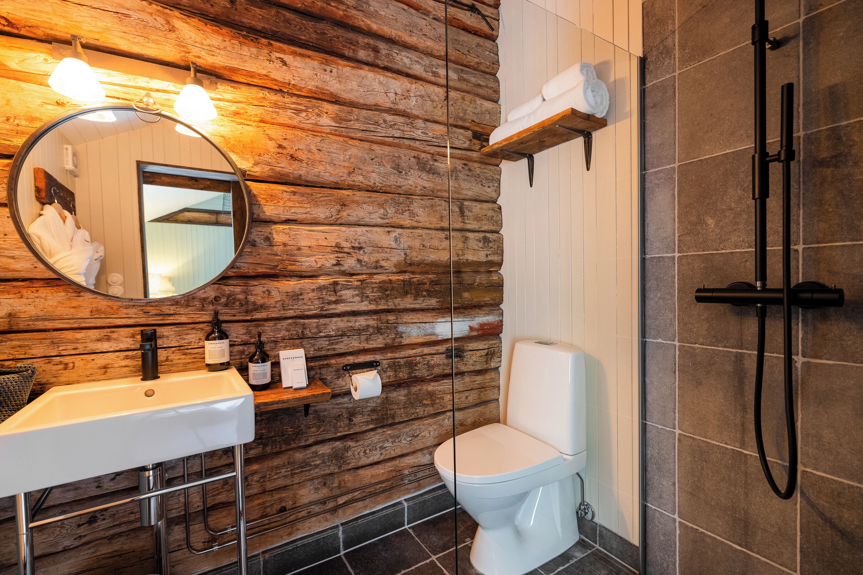 village cabin suite | bathroom | shower, designer toiletries, hair dryer, bathrobes