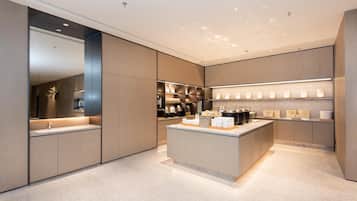 A modern kitchen with a central island, built-in appliances, and a sleek design.