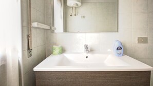 Apartment, 1 Bedroom | Bathroom sink - Teodorico (Milan)