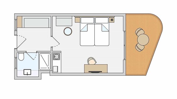 Plano de cubierta de un camarote con baño, una pequeña cocina, zona de comedor y área de estar.