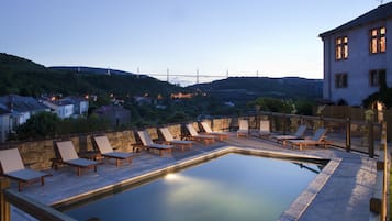 Seasonal outdoor pool, pool umbrellas, pool loungers