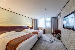 A hotel room with two beds, a desk, a chair, a television, and a large window with curtains. - Jiangxi Bailu Hotel (Nanchang County)