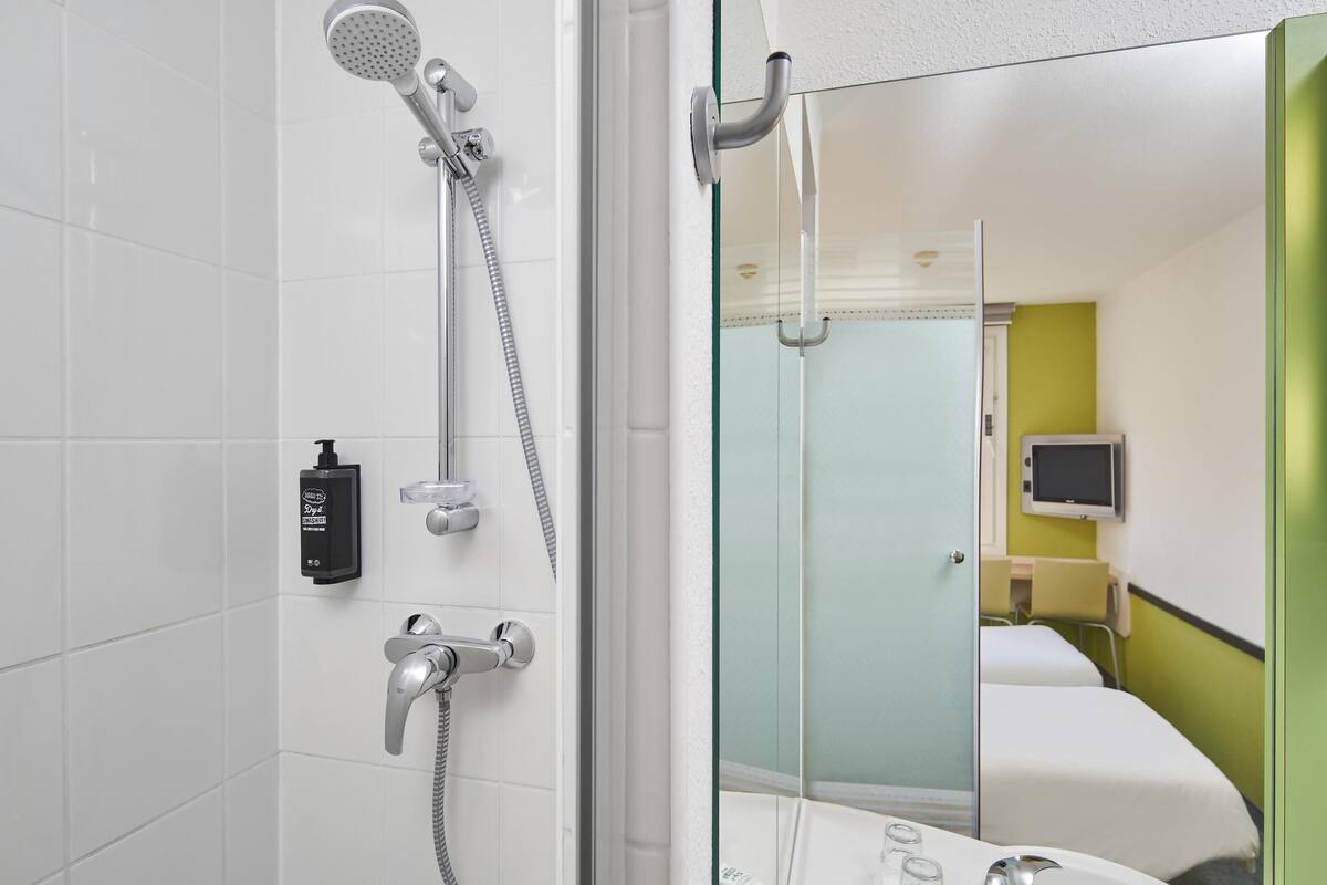 A modern bathroom with a glass shower enclosure, a handheld showerhead, a handheld showerhead, a handheld showerhead, a handheld showerhead, a handheld showerhead, a handheld showerhead, a handheld showerhead, a handheld showerhead, a handheld showerhead, a handheld showerhead, a handheld showerhead, a handheld showerhead, a handheld showerhead, a handheld showerhead, a handheld showerhead, a handheld showerhead, a handheld showerhead, a handheld showerhead, a handheld showerhead, a handheld showerhead, a handheld showerhead, a handheld showerhead, a handheld showerhead, a handheld showerhead, a handheld showerhead, a handheld showerhead, a handheld showerhead, a handheld showerhead, a handheld showerhead, a handheld showerhead, a handheld showerhead, a handheld showerhead, a handheld showerhead, a handheld showerhead, a handheld showerhead, a handheld showerhead, a handheld showerhead, a handheld shower