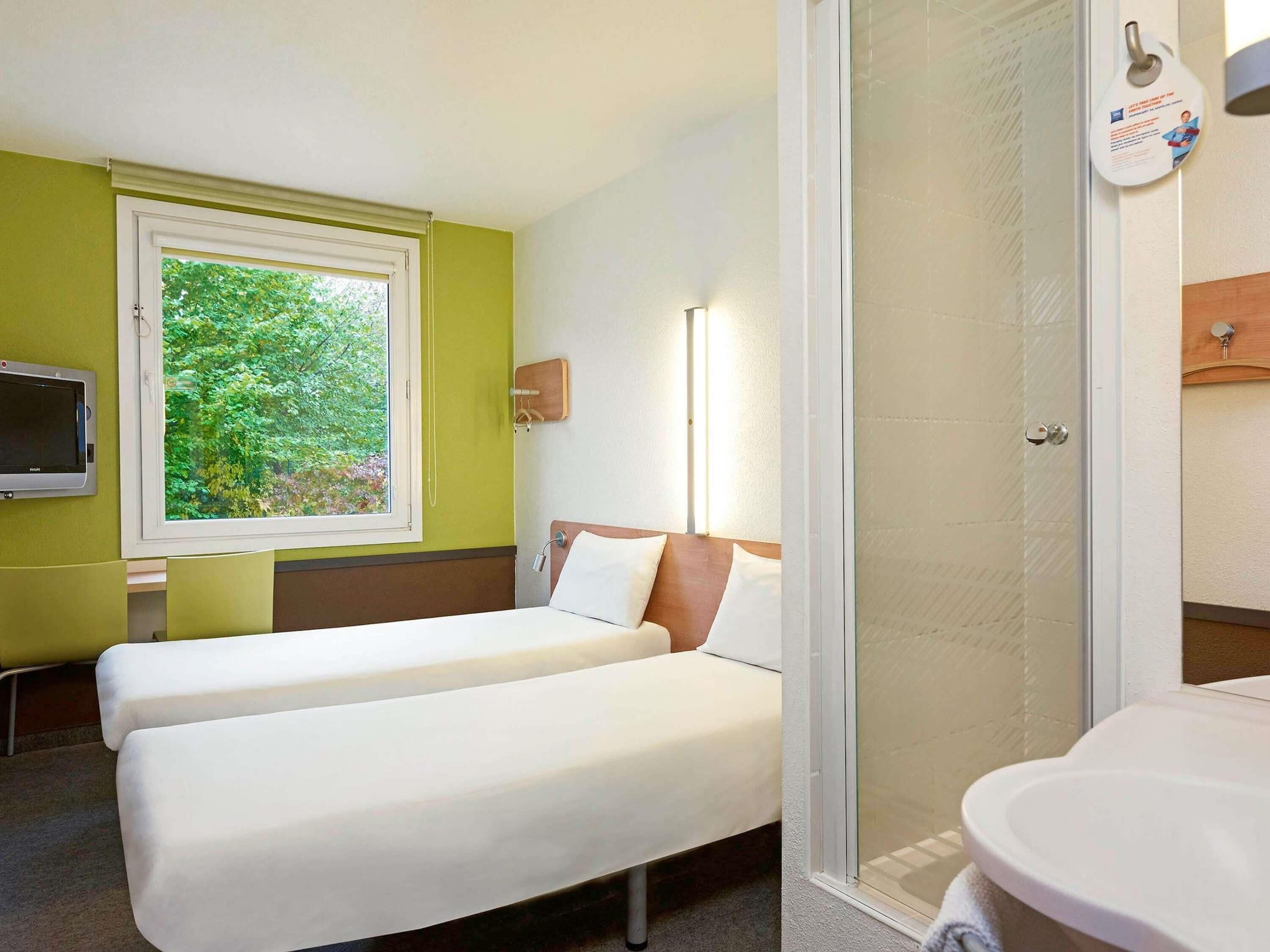 Desk, blackout drapes, iron/ironing board, free cribs/infant beds