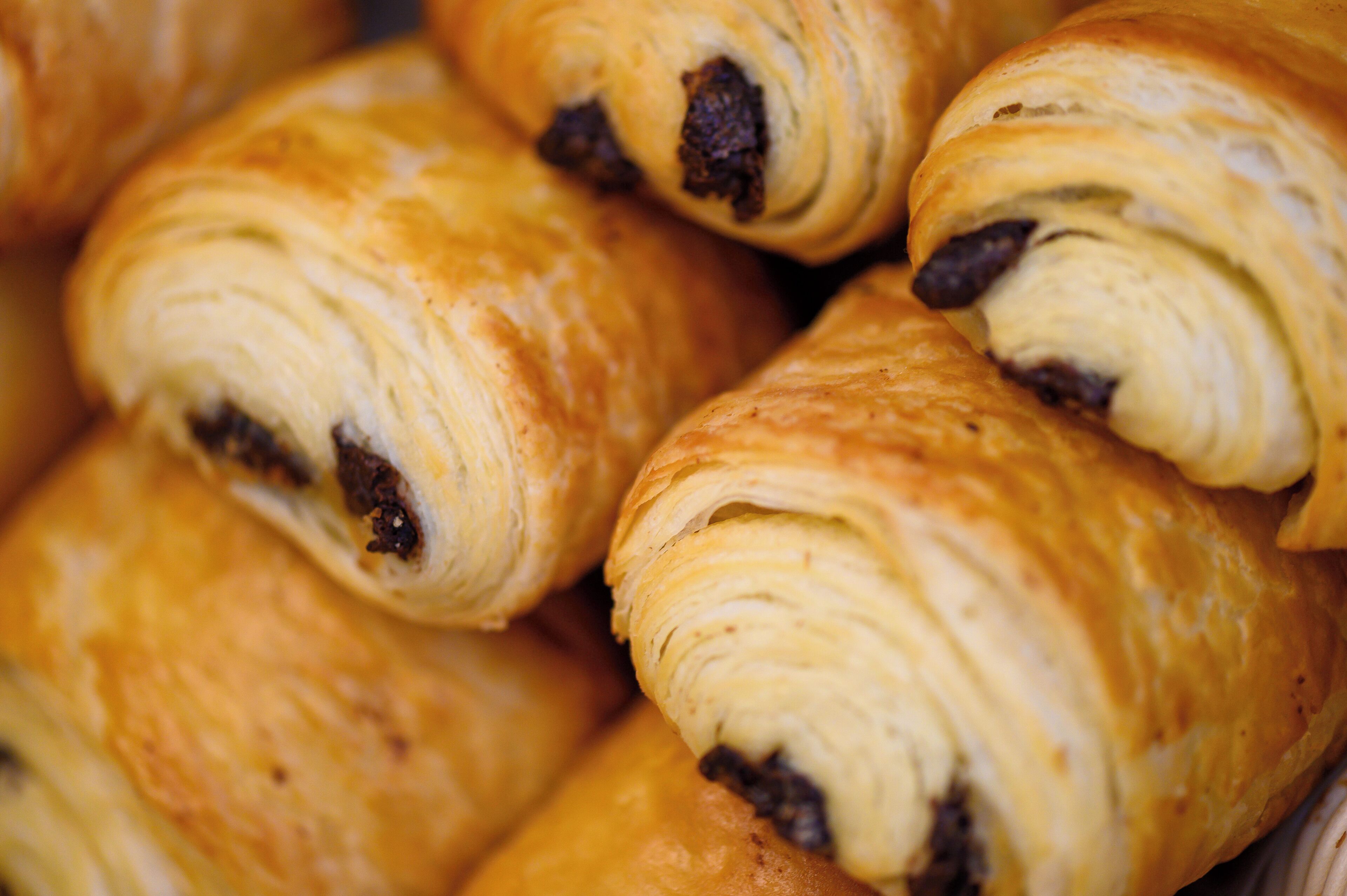 A close-up of chocolate-filled croissants.
