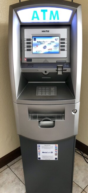 An ATM machine with a digital screen displaying a donation message. - Patuxent Inn (La Plata)
