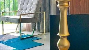 A room with a modern chair, a lamp, and a view of greenery outside. - Niza Five Luxury Beach Apartments (Puerto Vallarta)