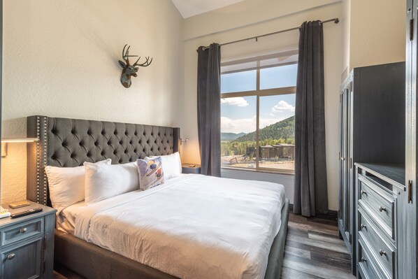 1 bedroom, premium bedding, laptop workspace, blackout curtains