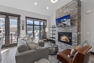 Deluxe Condo | Living area | 45-inch flat-screen TV with cable channels, TV, Netflix