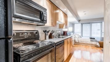 Deluxe Condo, Multiple Beds, Non Smoking | Private kitchen | Full-sized fridge, microwave, oven, stovetop