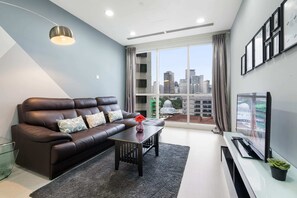 Business Apartment | Living room | LCD TV, Netflix - Binjai8 by Plush (Kuala Lumpur)