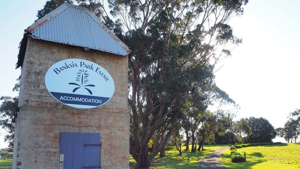A small brick building with a sign for Banksia Park Estate Accommodation. - Banksia Park Estate (Newhaven)