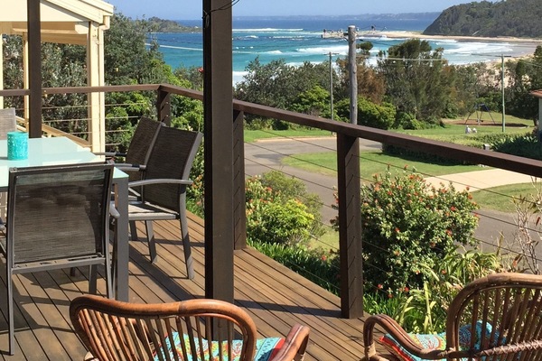 Relax on the deck and watch the waves roll in