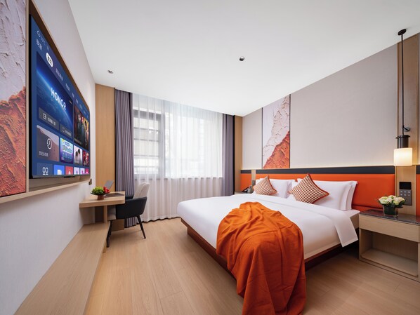 A modern hotel room with a large bed, a desk, and a flat-screen TV mounted on the wall. - YiWu Defeng Hotel (Jinhua)