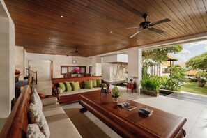 9 Bedroom Pool Villa | Living area | 50-inch Smart TV with digital channels, books - The Bija Villas by Nakula (Canggu)