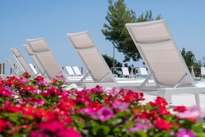 2 outdoor pools, pool umbrellas, pool loungers