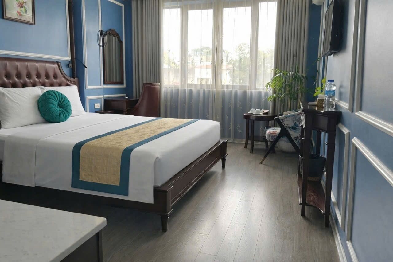 Habitación Deluxe | Ropa de cama de alta calidad y minibar 