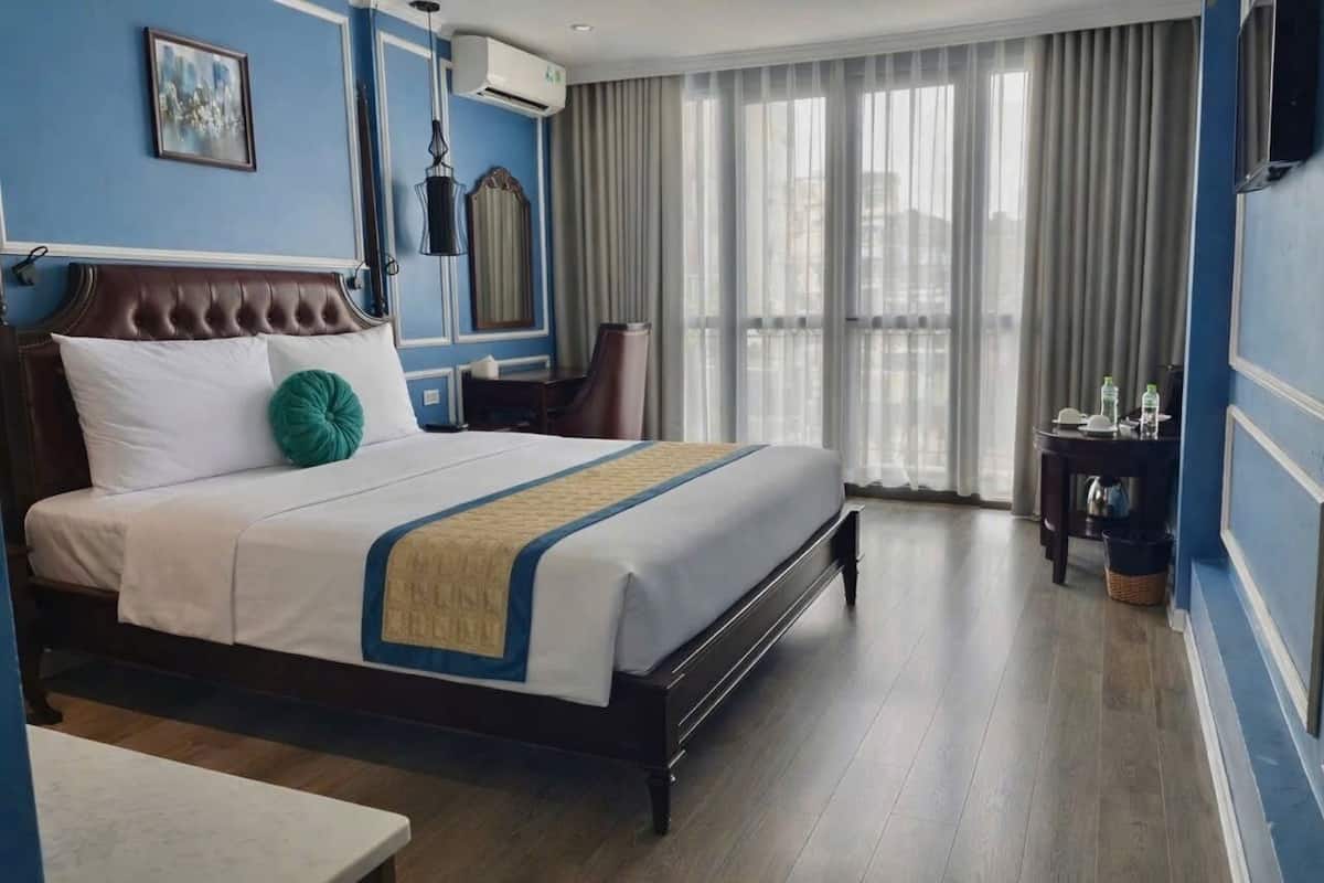 Habitación junior | Ropa de cama de alta calidad y minibar