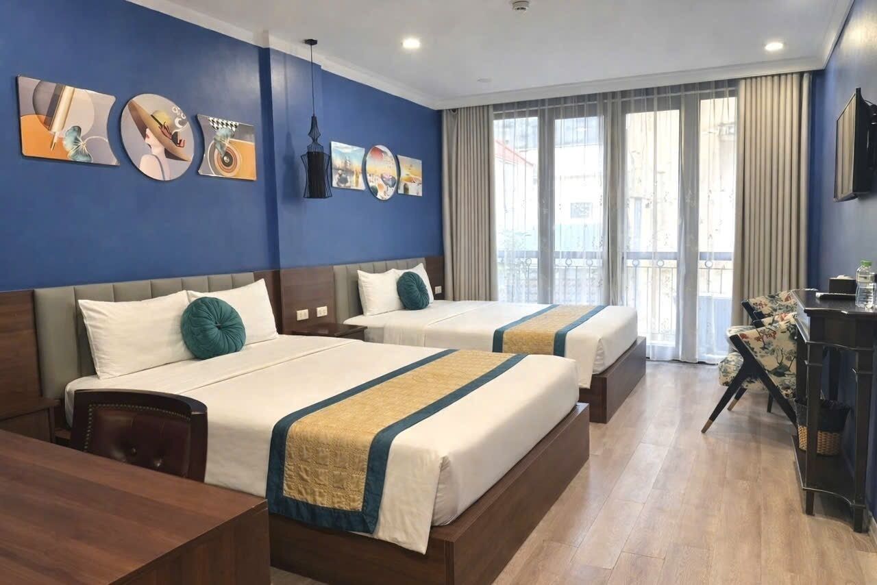 Habitación cuádruple familiar | Ropa de cama de alta calidad y minibar 