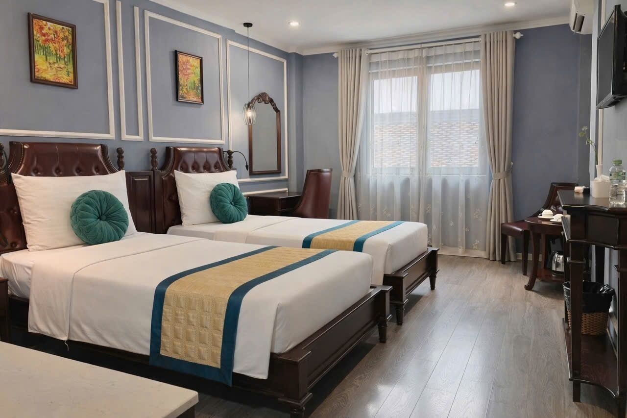 Habitación Deluxe | Ropa de cama de alta calidad y minibar 