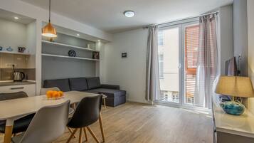 Apartment, 2 Bedrooms | Living area | 42-inch flat-screen TV with cable channels, TV