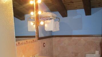 Deep-soaking bathtub, rainfall showerhead, free toiletries, towels