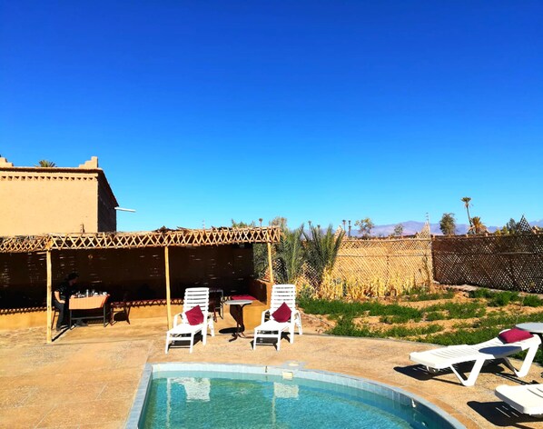 2 outdoor pools, pool umbrellas, pool loungers