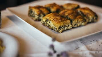 A plate of baked goods on a white tablecloth.