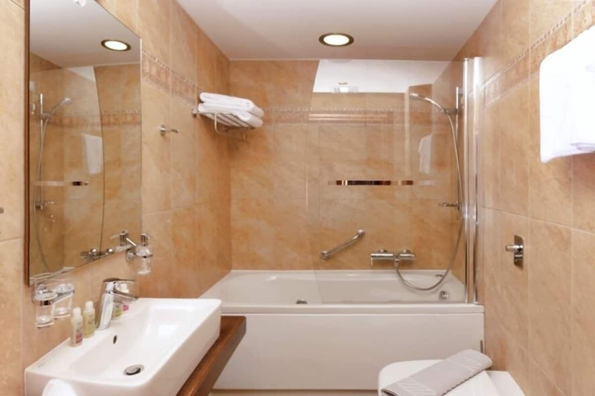 double room | bathroom | bathtub, deep-soaking bathtub, free toiletries, hair dryer