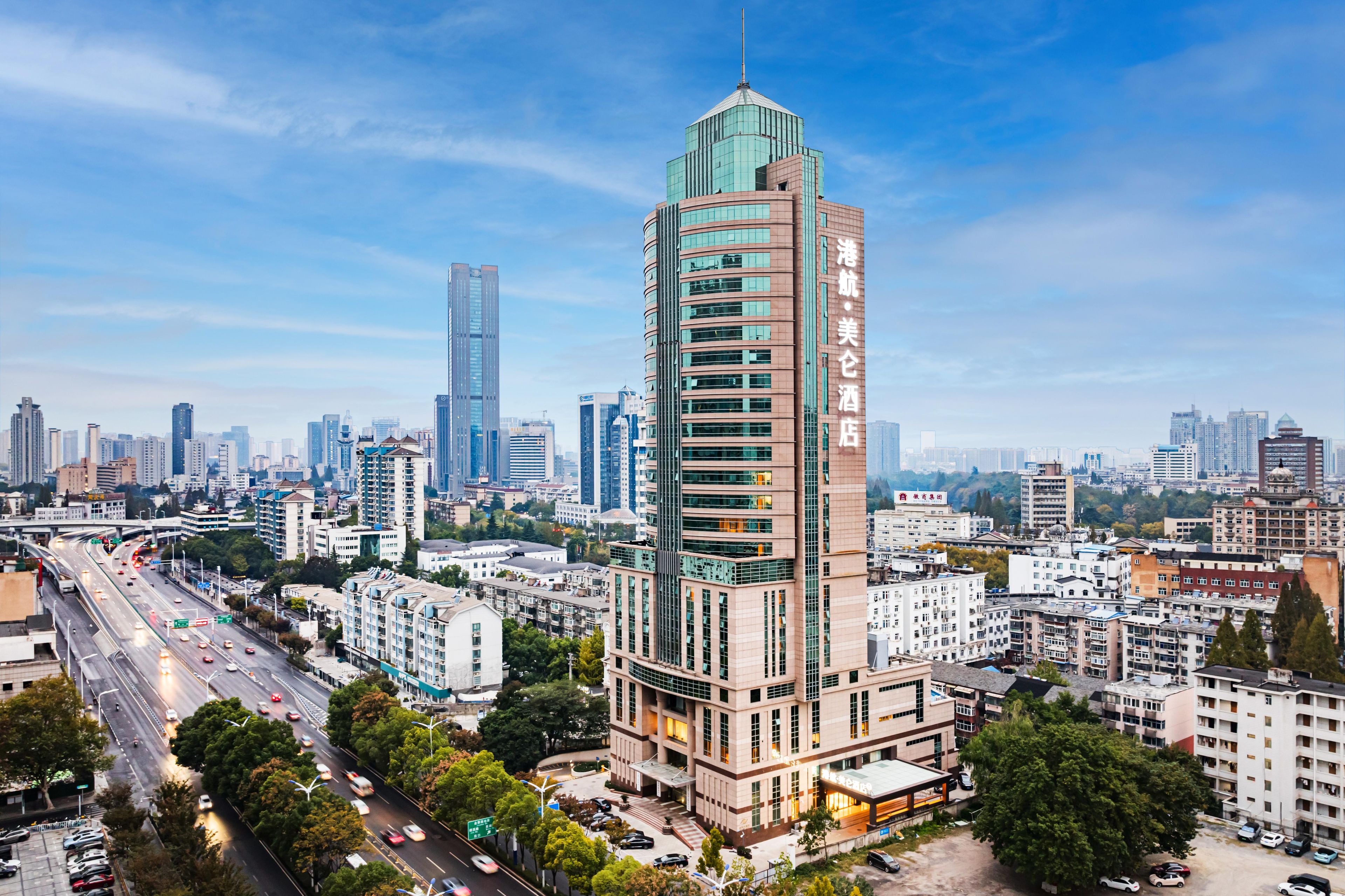 A high-rise hotel with a modern design, multiple floors, and a prominent entrance.