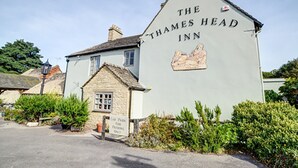 The Thames Head Inn, a traditional building with a sign indicating a car park for patrons only.
