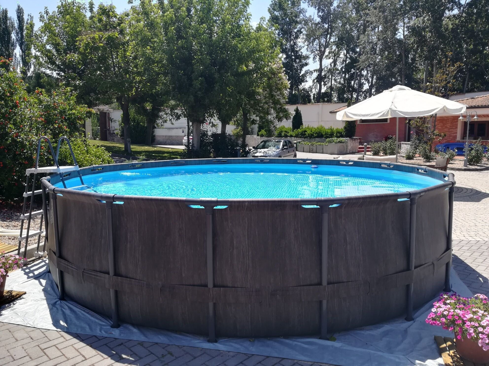 seasonal outdoor pool, open 9:00 am to 8:30 pm, pool umbrellas