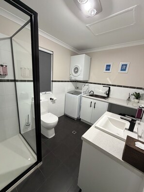 Shower, hair dryer, towels, soap