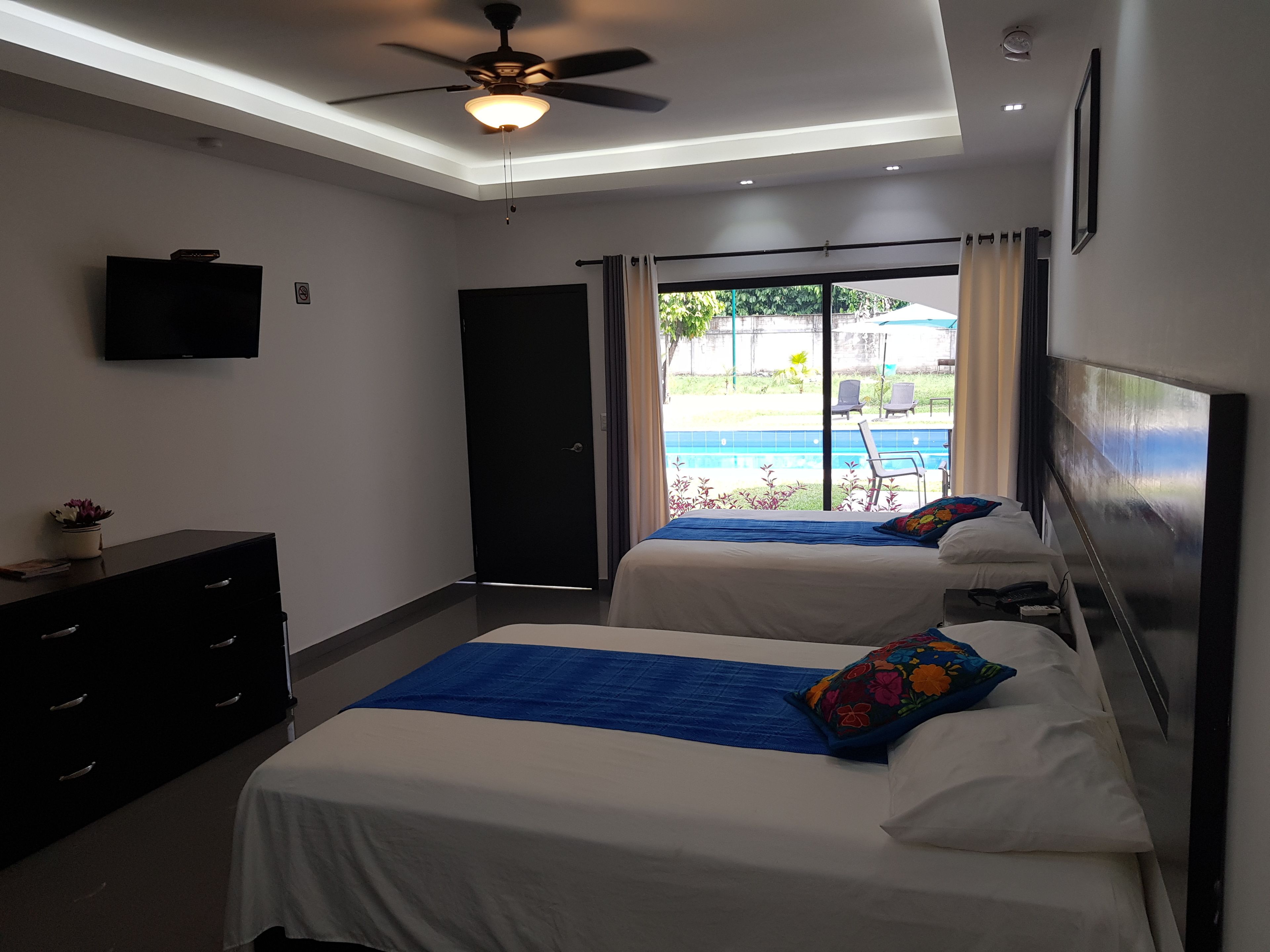 family double room, 2 double beds, accessible, pool view | 12 bedrooms, in-room safe, individually decorated