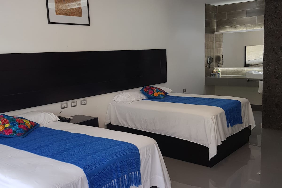 family double room, 2 double beds, accessible, pool view | 12 bedrooms, in-room safe, individually decorated