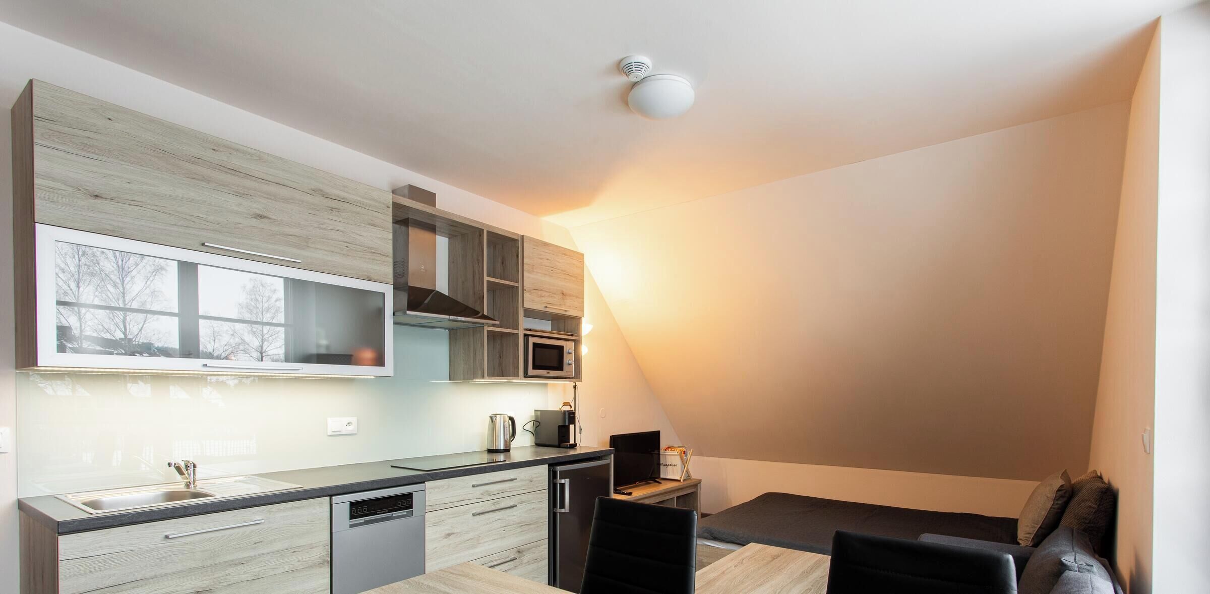 Exclusive Apartment | Living area | Flat-screen TV, heated floors