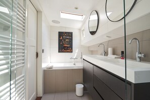Bathtub, hair dryer, towels, soap