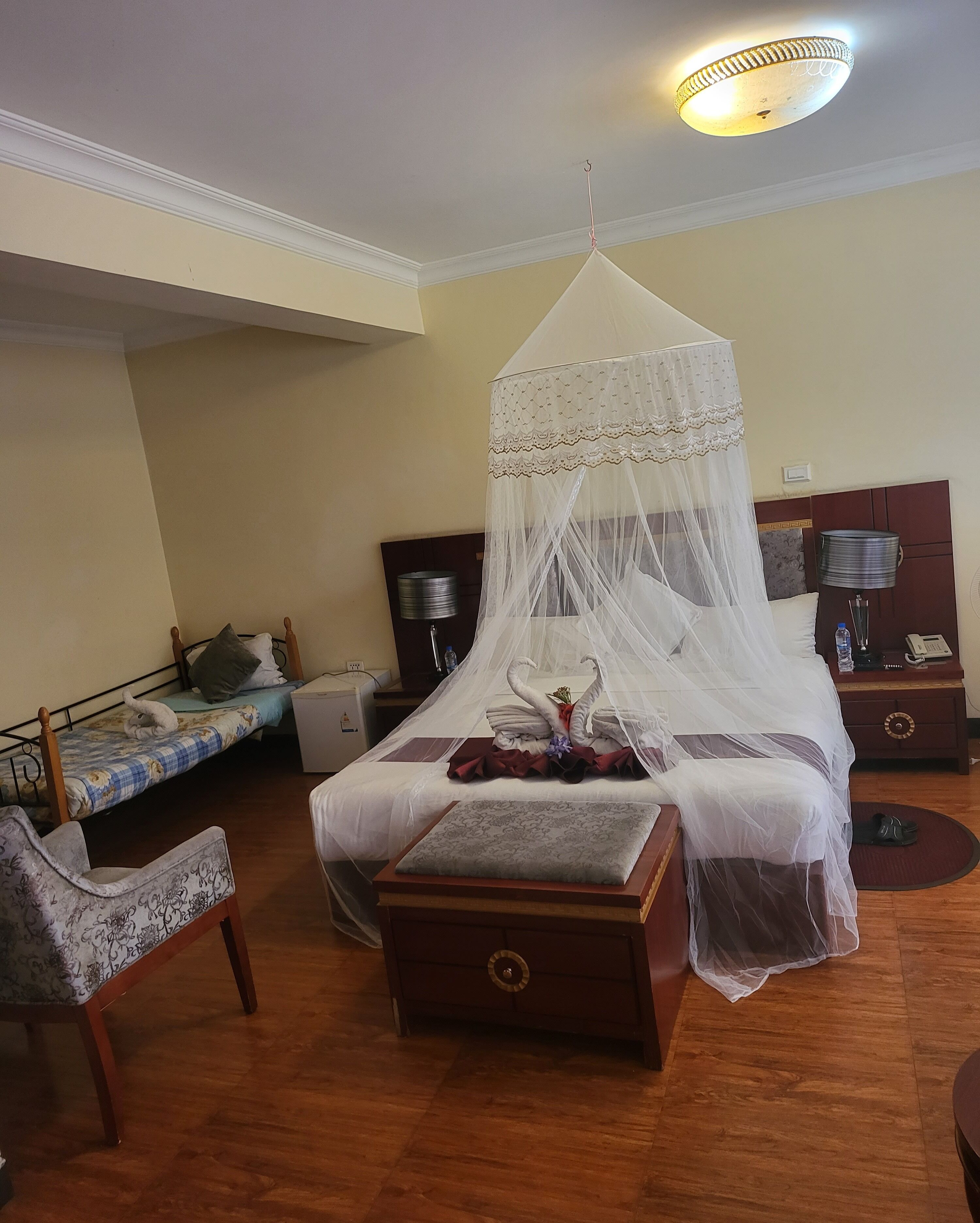 desk, laptop workspace, blackout curtains, travel cot